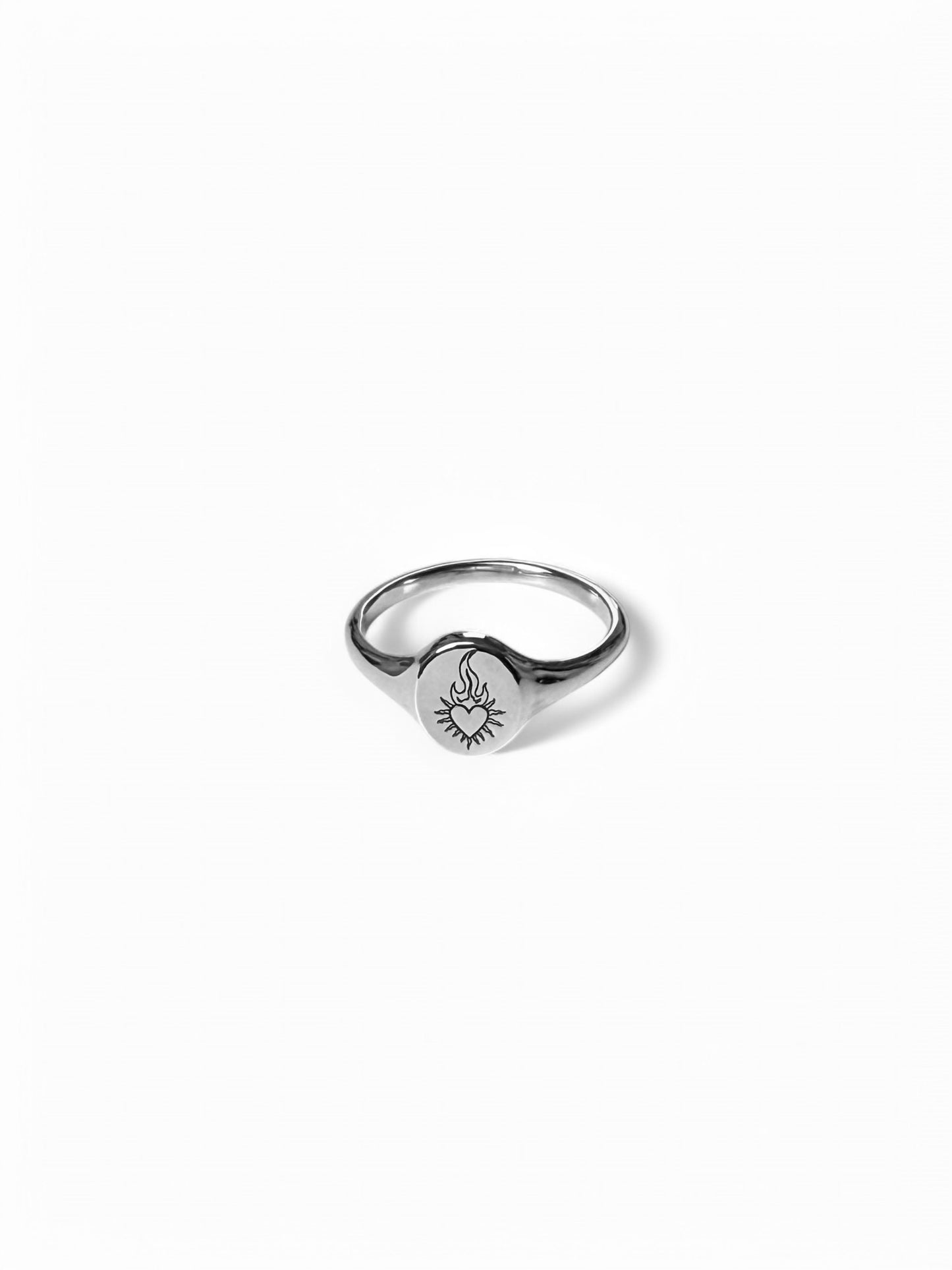 Silver mini signet ring with flaming heart enraved on it. Sold on its own( shop other rings on the website)