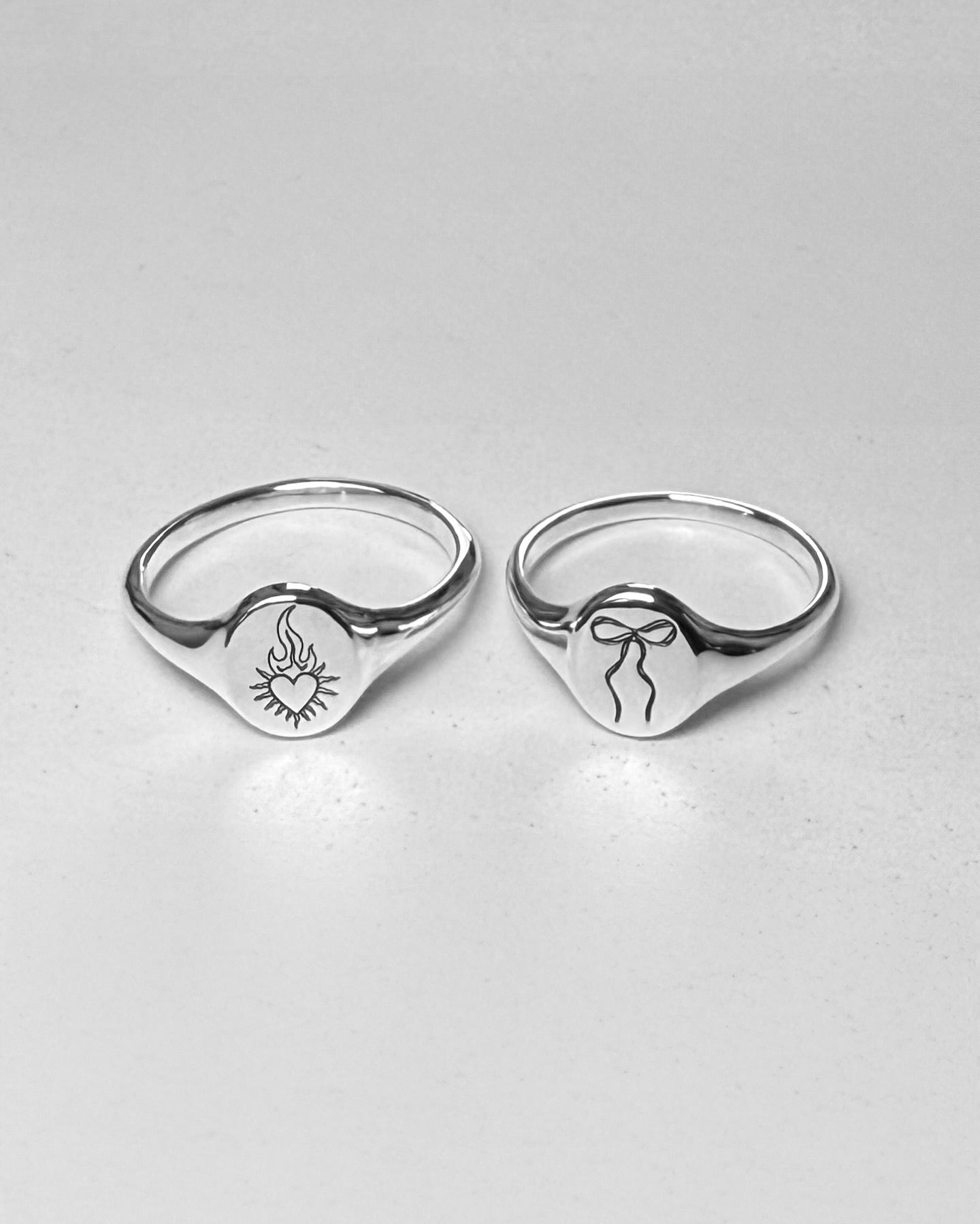 Silver mini signet ring with flaming heart enraved on it. Sold on its own( shop other rings on the website)